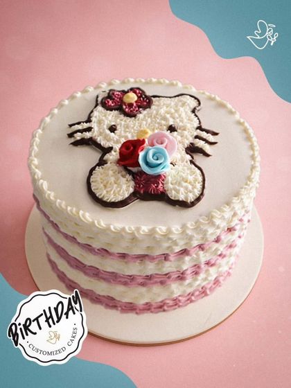 A simple and sweet Hello Kitty cake with a striped buttercream finish. The cute character design is perfect for a fan who loves classic and charming styles.