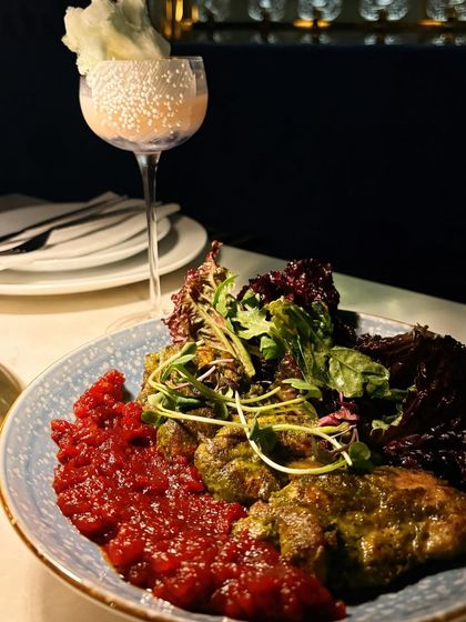 Chimichurri Chicken with Tomato Jam from Torte. The colors and plating are the focus here, showing the artistry that goes into every dish.