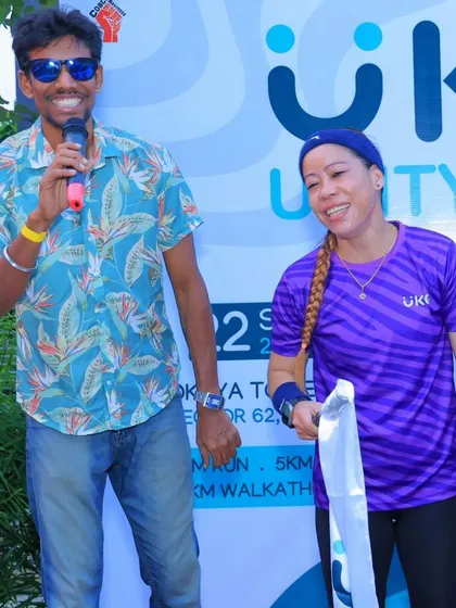 My event host sharing a fun moment on stage with Mary Kom. I ensure my event hosts are engaging and can create a lively rapport with special guests and the audience.