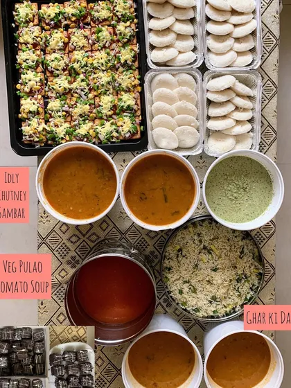 Another view of a large catering order with Idly, Sambar, Pizza Crackers, and more.