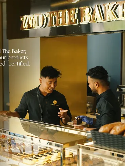 My team and I are proud to uphold our "Zed Certified" standards of quality. Here we are at our gleaming pastry counter, ready to serve you with a smile.