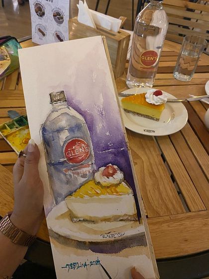 A duplicate shot of my Glen's cheesecake watercolor sketch. It's a sweet memory of a delicious treat and a moment of creative joy.