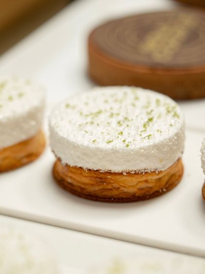 A beautiful example of balancing textures and flavors. This dessert features a flaky puff pastry base topped with a light, airy mousse and a hint of lime zest.