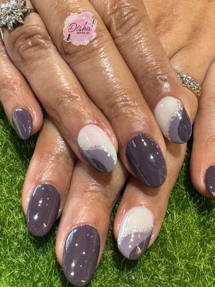 A sophisticated design with shades of purple and a delicate silver glitter accent.