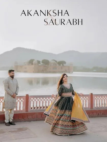 A beautiful twirl against the backdrop of Jal Mahal. The bride's lehenga and the stunning scenery come together to create a photo that is full of life, color, and celebration.
