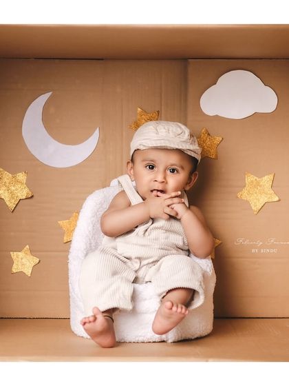 Twinkle, twinkle, little star. A creative "in the box" setup with a moon and stars theme is a wonderful way to document your baby's half-birthday milestone.