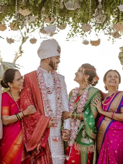 A beautiful family portrait with the happy couple and their parents.