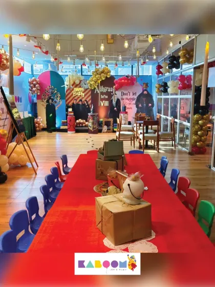 A different angle of the Great Hall setup, highlighting the atmospheric lighting and themed centerpieces that complete the magical ambiance for a spellbinding birthday.