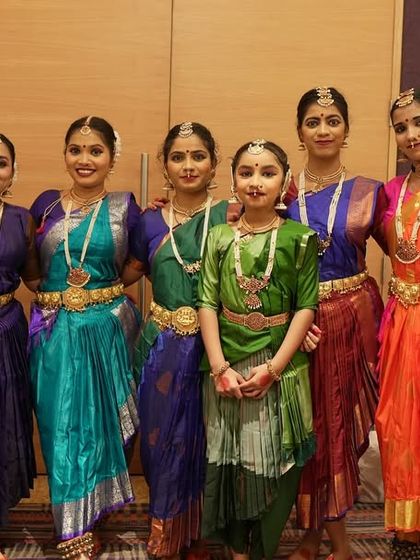 A group of our senior students in their vibrant costumes, ready to go on stage. The camaraderie and excitement backstage are an integral part of the performance experience.