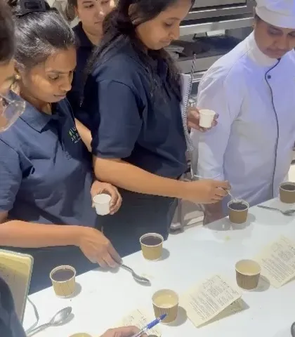 Participants at the Just Appetite workshop carefully tasting and evaluating different coffees.
