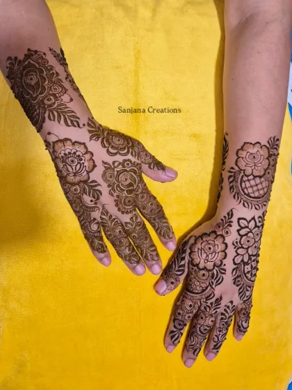Another angle of the Dubai-style floral mehndi, showing how the design flows beautifully up the arm.