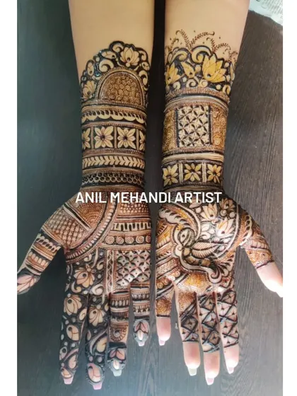 This full-hand design features a beautiful contrast between light and dark shading. The pattern includes traditional floral bands and a central lotus motif on the palm.