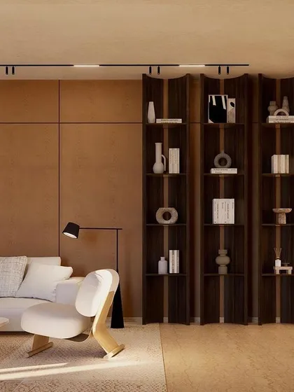 A custom-designed shelving unit acts as both a display and a subtle space divider in the informal living area. The dark wood contrasts beautifully with the neutral tones of the room.
