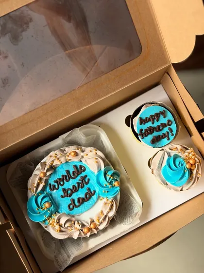 Celebrate the "World's Best Dad" with this handsome blue and gold themed bento and cupcake set. The intricate piping and gold sprinkle details make it feel extra special for Father's Day.