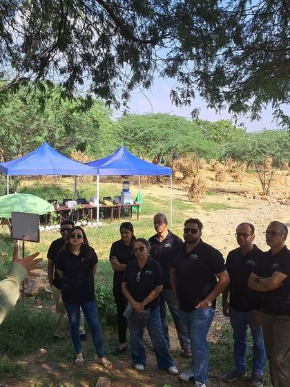 Our team member engages with the Bacardi volunteers, sharing knowledge about the native ecosystem and the restoration process at Aravali Nagar Van.