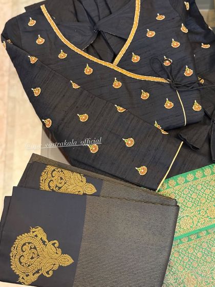 A black angrakha-style blouse with gold butis.