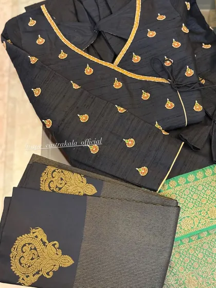 Another view of the black angrakha blouse, showing the elegant wrap design and the intricate zardosi work on the accompanying fabric.