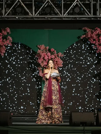 A powerful shot from a beautiful wedding I hosted in Udaipur. Standing on a grand stage, I make sure every announcement and performance is delivered with charisma, making the Sangeet night a spectacular show.
