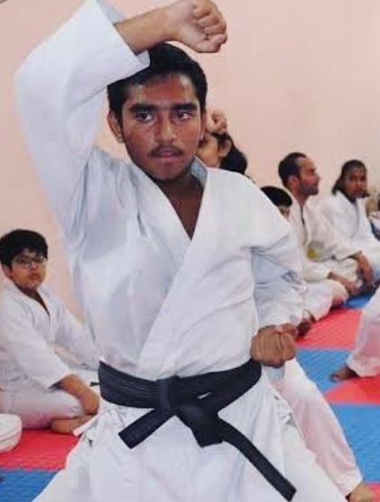 A close-up shot during an indoor training session. You can see the focus and determination as I practice a blocking technique.