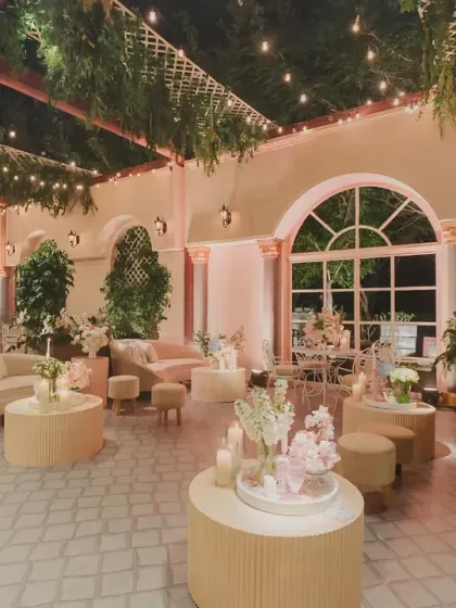 A wide view of the Parisian-inspired lounge area, with comfortable sofas and soft lighting creating a relaxed and sophisticated space for guests.
