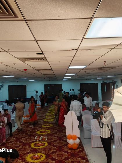 A naming ceremony in progress. I ensure the decor, like the floral rangoli on the aisle, adds to the traditional and auspicious feel of the event.