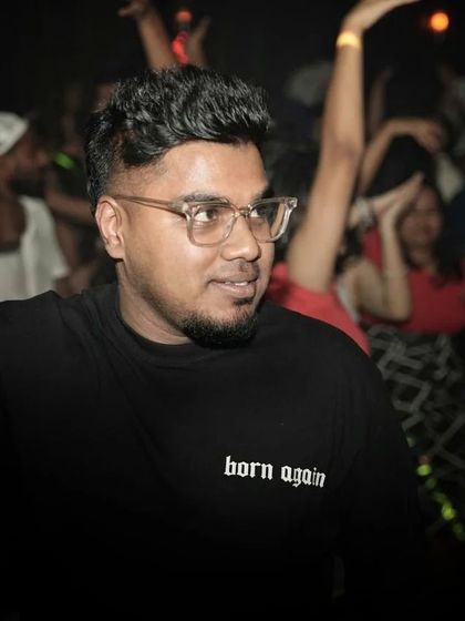 A candid moment captured mid-set. I'm always watching the crowd, seeing what they respond to, and planning my next move.