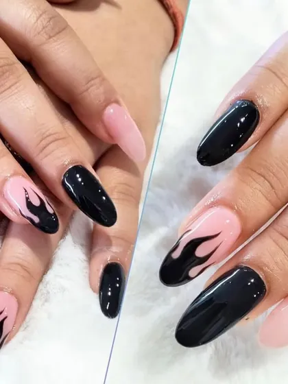 For those who like it bold, this design features edgy black flame art hand-painted over a soft pink base on long, almond-shaped nails.