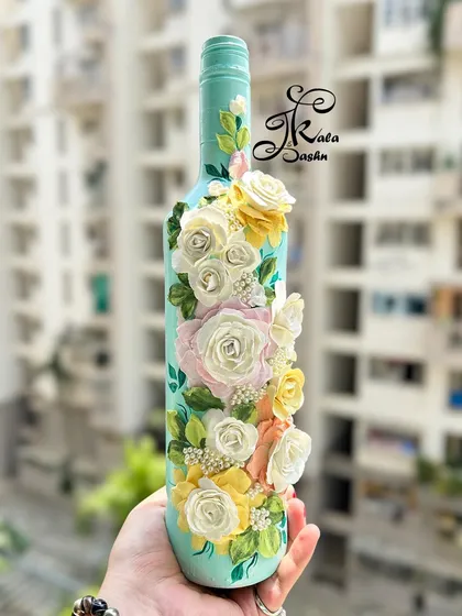 I believe in finding beauty in everyday objects. Here, I've upcycled a simple bottle into a decorative vase, covering it with a cascade of delicate, hand-sculpted pastel roses and pearls. It’s a perfect example of how sculpture art can elevate any corner of your home.