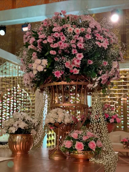 A close-up of a stunning floral centerpiece, part of a larger decor scheme that whispers elegance and romance. The mix of pinks and whites is timeless.