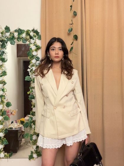 Who says workwear has to be boring? I paired this sharp, double-breasted blazer with a delicate lace skirt for a look that’s professional yet full of personality.