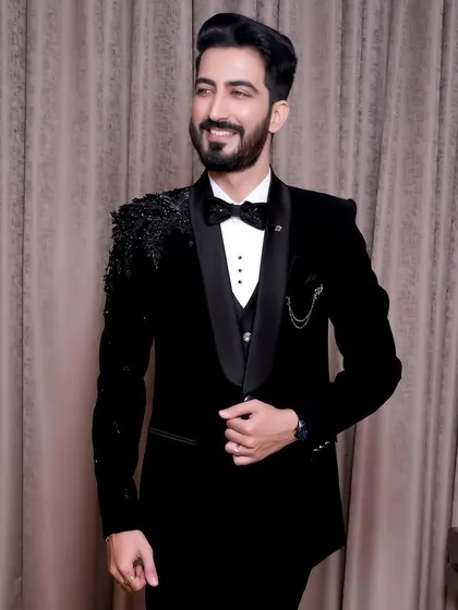 This groom is ready for his reception. I created a polished hairstyle and a defined makeup look that works perfectly with his black-tie attire, highlighting his features for a sophisticated evening style.