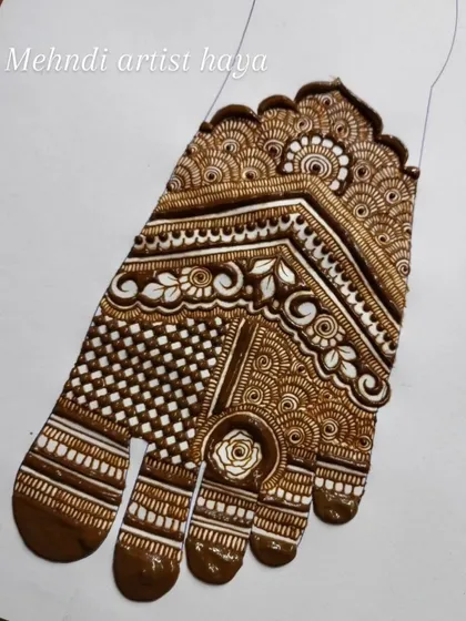 A very detailed and structured foot design on paper. The chevron pattern and intricate fillers create a rich, tapestry-like effect.