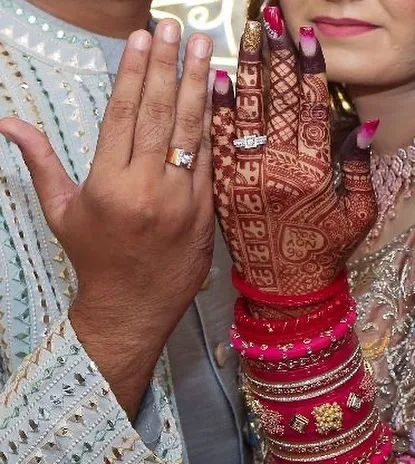 The engagement photo, where the hands and rings take center stage. I designed these bold pink and gold glitter nails to make sure her hands looked absolutely stunning for this memorable moment.