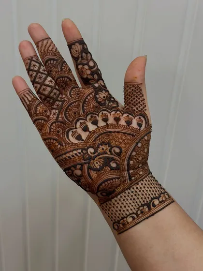 A perfect example of a graceful and elegant design. The student has done a fantastic job with the flowing patterns and consistent line work, creating a very professional finish.