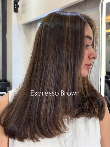 Espresso brown is a fantastic choice for a subtle but impactful change. These delicate highlights add dimension to the deep brown base color for a sophisticated look.