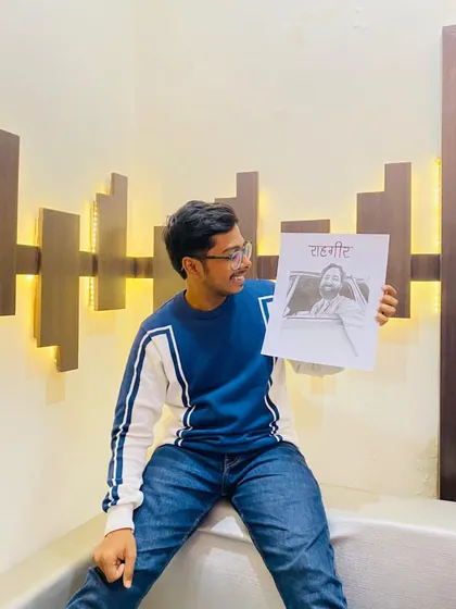Here I am, holding the completed sketch of Rahgir. It's always a great feeling to finish a portrait of an artist you admire.