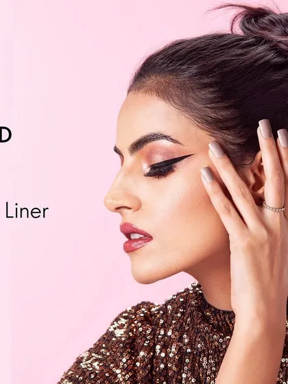 Another look from the same beauty campaign, this time showcasing a profile view. The styling is kept elegant and minimal to draw attention to the precise application of the gel eye liner.