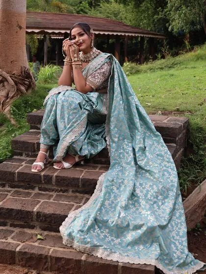 A happy pose in the blue Nauvari, perfect for an outdoor pre-wedding shoot.
