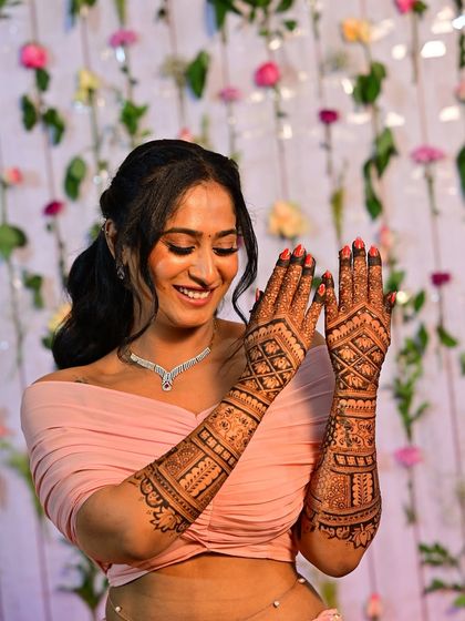 Shilpa's joyful expression as she shows off her full bridal mehendi.