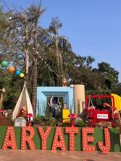 For this 'Wild Two' jungle themed birthday, we created a massive custom stage with marquee letters, a waterfall feature, and life-sized animal props to serve as the perfect backdrop for the celebration.