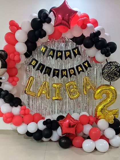 A Mickey Mouse themed balloon ring for a 2nd birthday. This classic red, black, and white setup is perfect for a fun and simple photo backdrop at home.