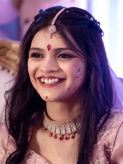 A candid moment of pure joy during the Haldi ceremony. The bride's infectious smile says it all.
