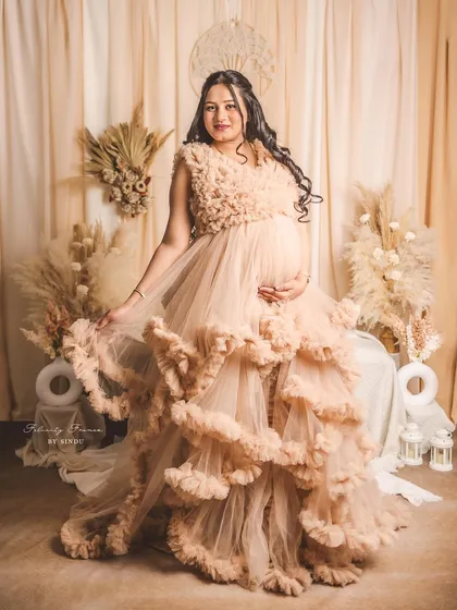 For the mama who loves drama, our Paige gown delivers. With layers upon layers of dramatic ruffles, this dress creates incredible texture and volume for a high-fashion maternity statement.
