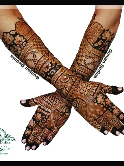 A full back-hand bridal mehendi design. The intricate patterns and motifs create a stunning 'glove' effect that is perfect for wedding photos.
