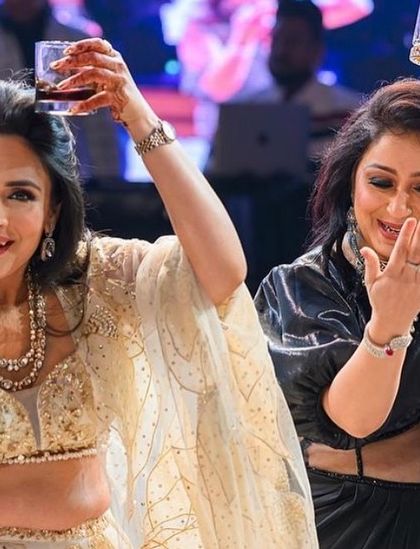 A fun 'cheers' moment during a performance. I love adding playful props and actions to my choreography.