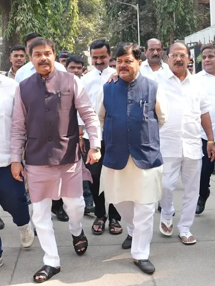 Two politicians, including Prasad Lad, walking together. Both are dressed in my custom kurtas and waistcoats, showcasing a look of power and tradition.