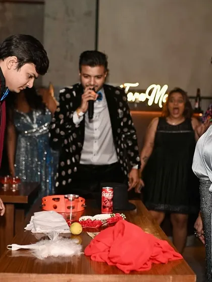 Leading a fun game at a cocktail party. These interactive moments are what make an event truly engaging and memorable for everyone.