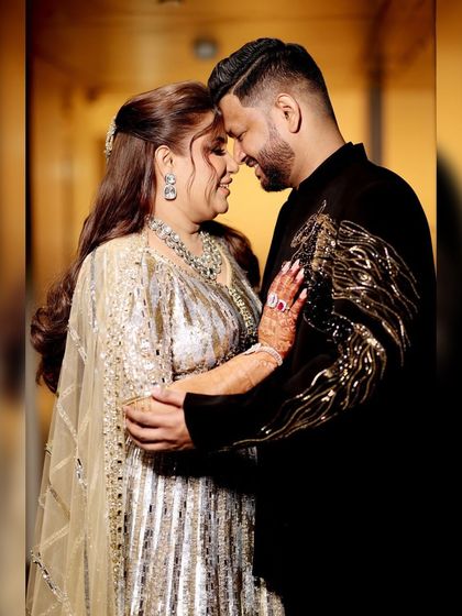 Another beautiful shot of the couple, showing the detail of the groom's embroidered velvet jacket. The perfect outfit for a memorable wedding reception.