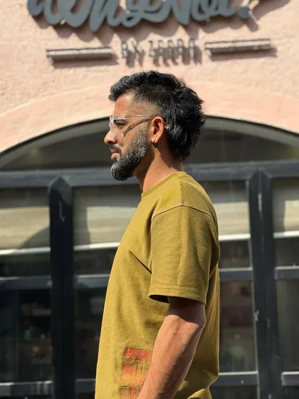 The mullet is back and more stylish than ever. This modern take features a faded temple and a textured top, keeping the business in the front and party in the back.