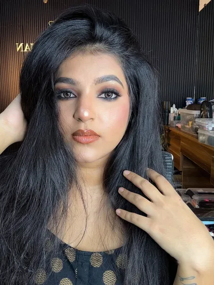 The full-face look with the soft smokey eye and a warm, brick-toned lipstick.